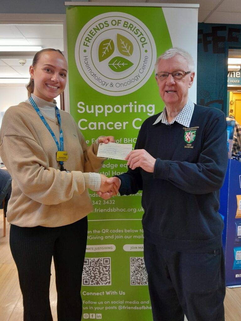 W Bro Alan Groves presenting a cheque to Charity
